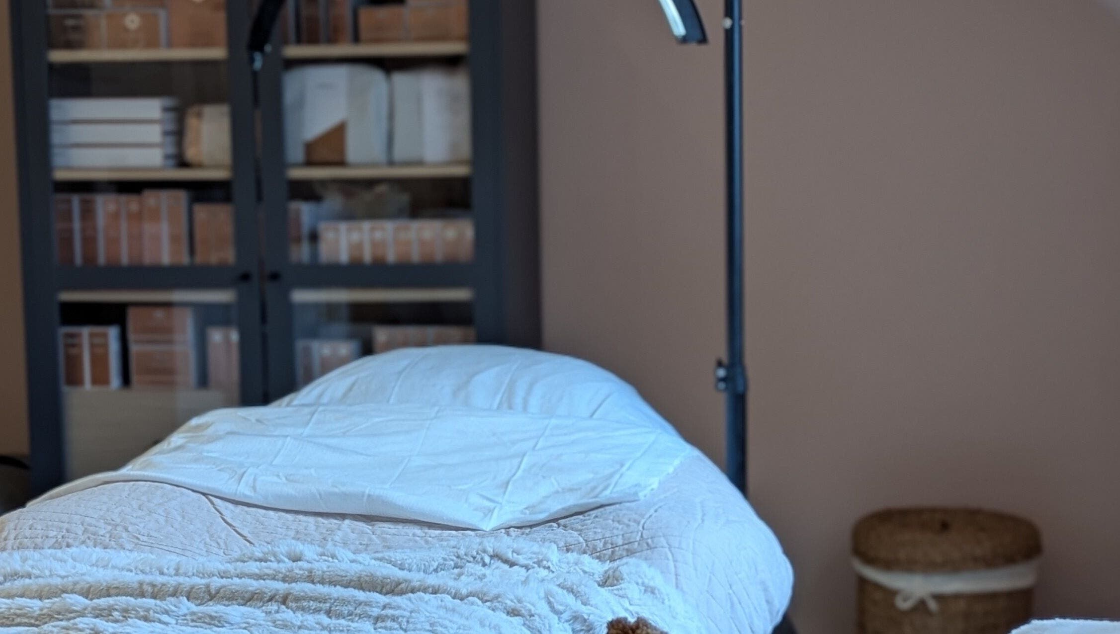 Cozy treatment room at Glow Studio by Suzanne Wilson, Musselburgh, Scotland, GB, featuring a comfortable massage table.