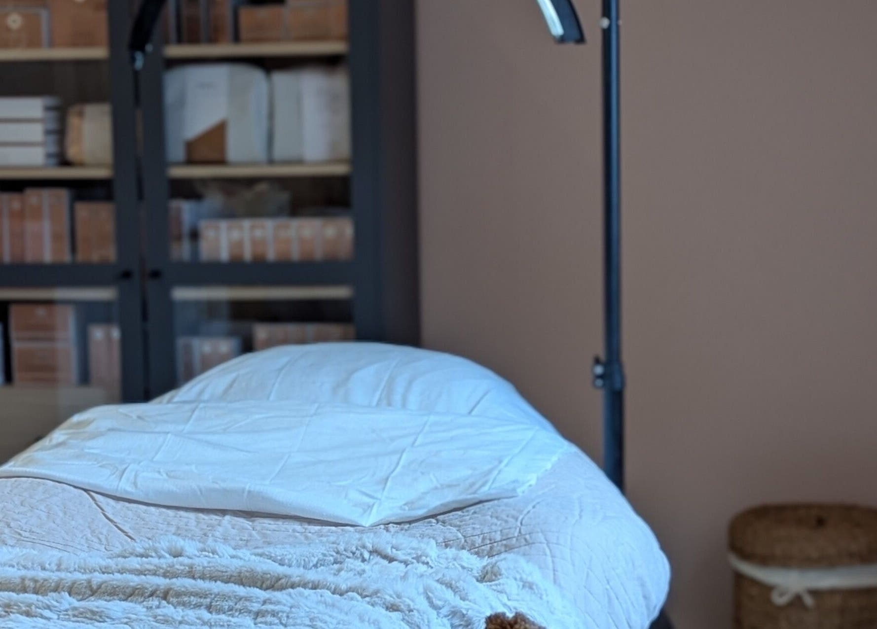 Cozy treatment room at Glow Studio by Suzanne Wilson, Musselburgh, Scotland, GB, featuring a comfortable massage table.