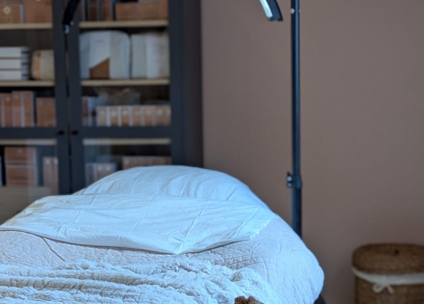 Cozy treatment room at Glow Studio by Suzanne Wilson, Musselburgh, Scotland, GB, featuring a comfortable massage table.