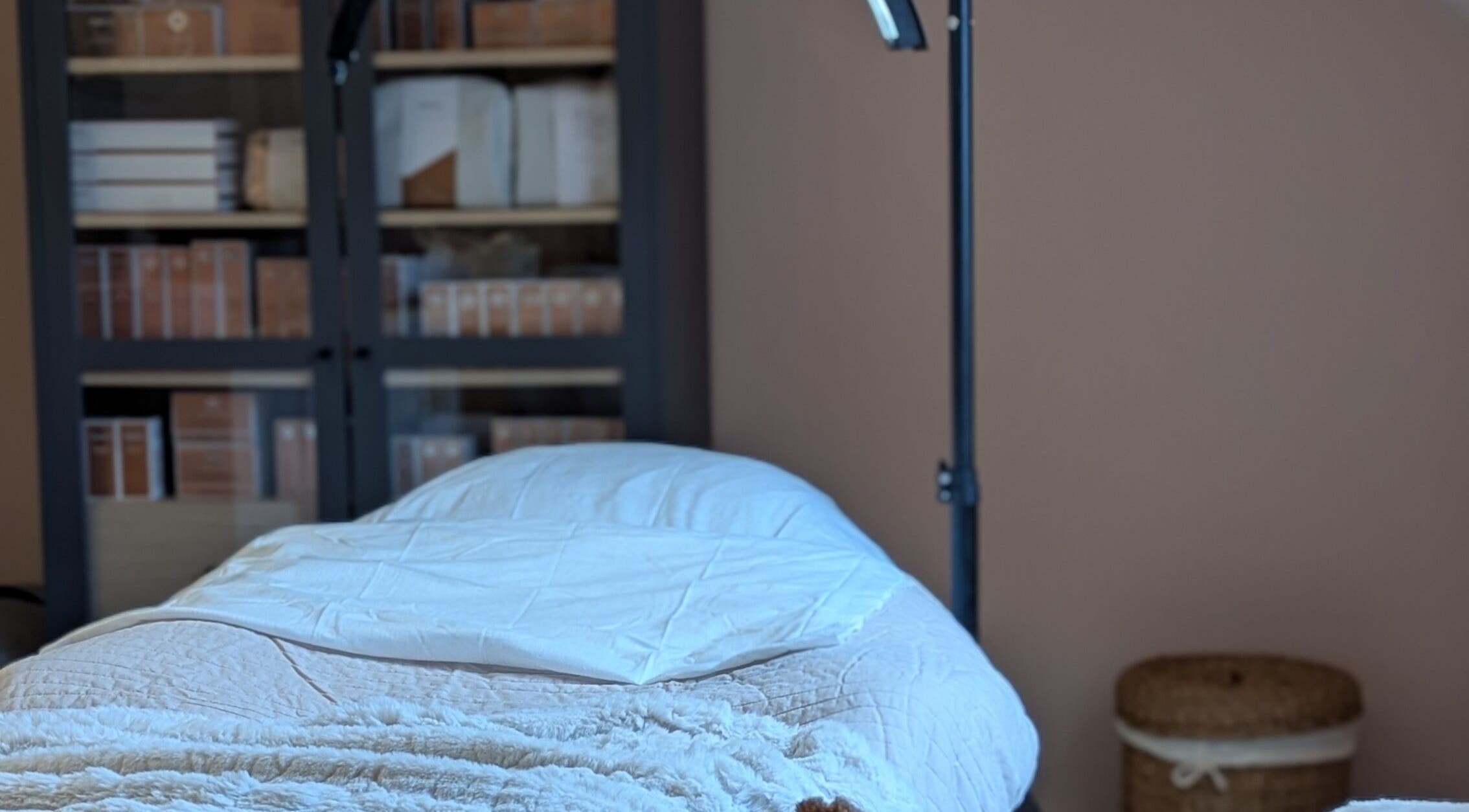 Cozy treatment room at Glow Studio by Suzanne Wilson, Musselburgh, Scotland, GB, featuring a comfortable massage table.