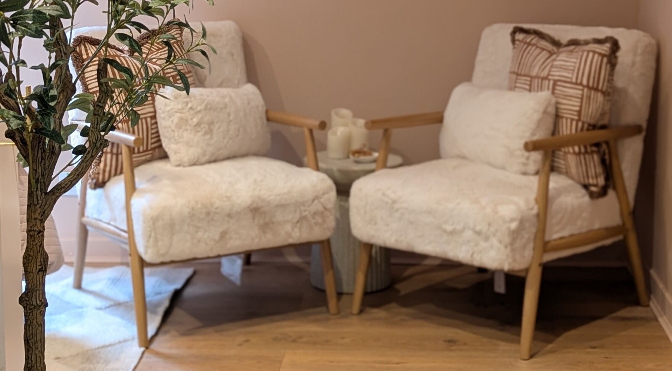 Elegant seating area at Glow Studio by Suzanne Wilson, Musselburgh, Scotland, GB with soft chairs and decor.