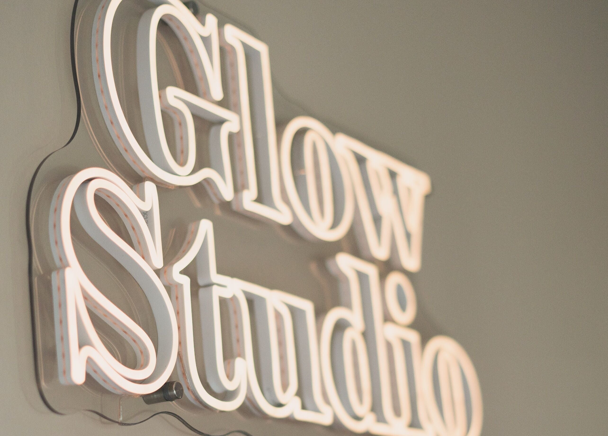 Illuminated Glow Studio sign at Glow Studio by Suzanne Wilson, Musselburgh, Scotland, GB.
