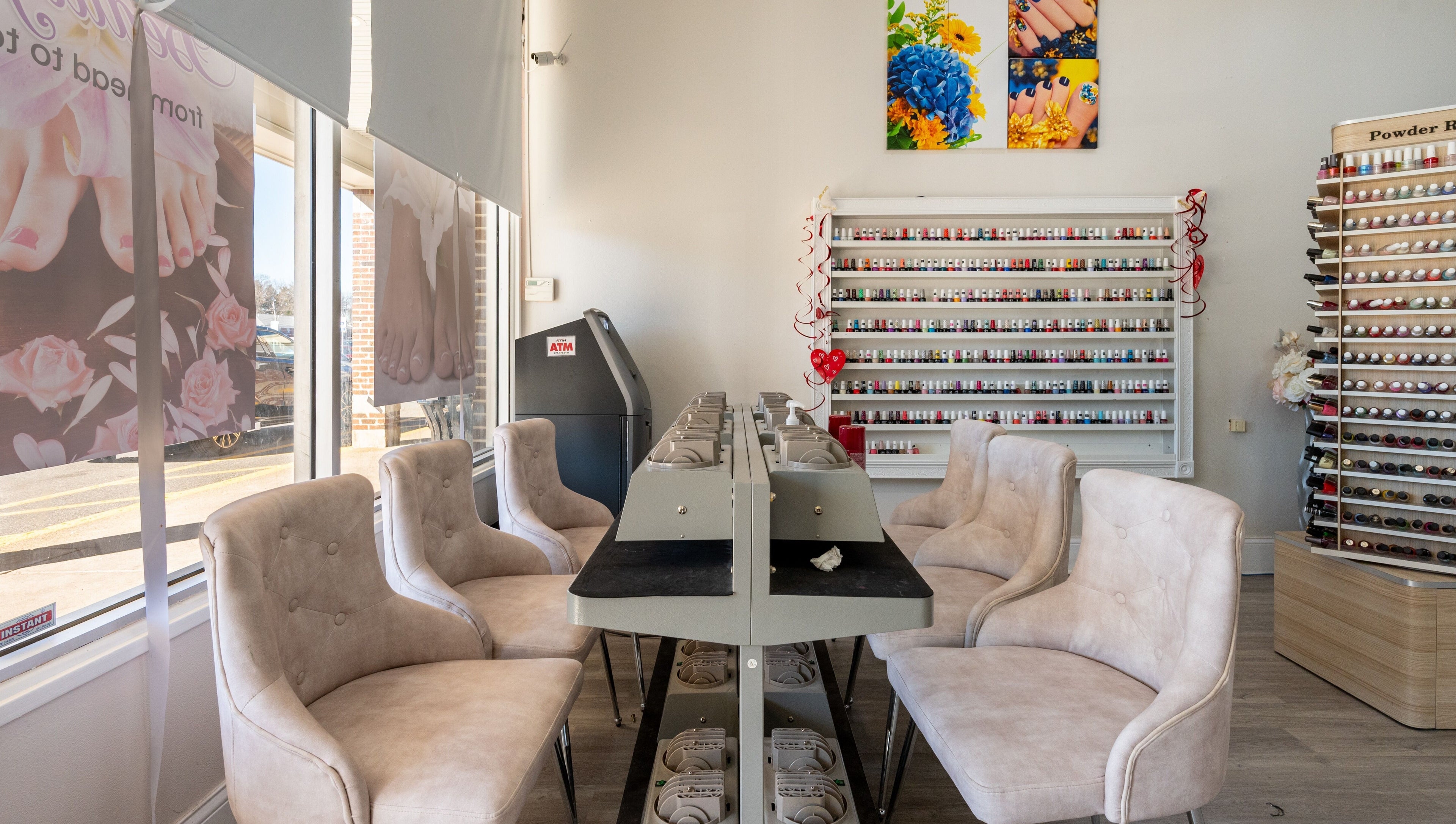 Luxor Nails and Spa interior with cushioned chairs and polish racks, North Reading, Massachusetts, US.