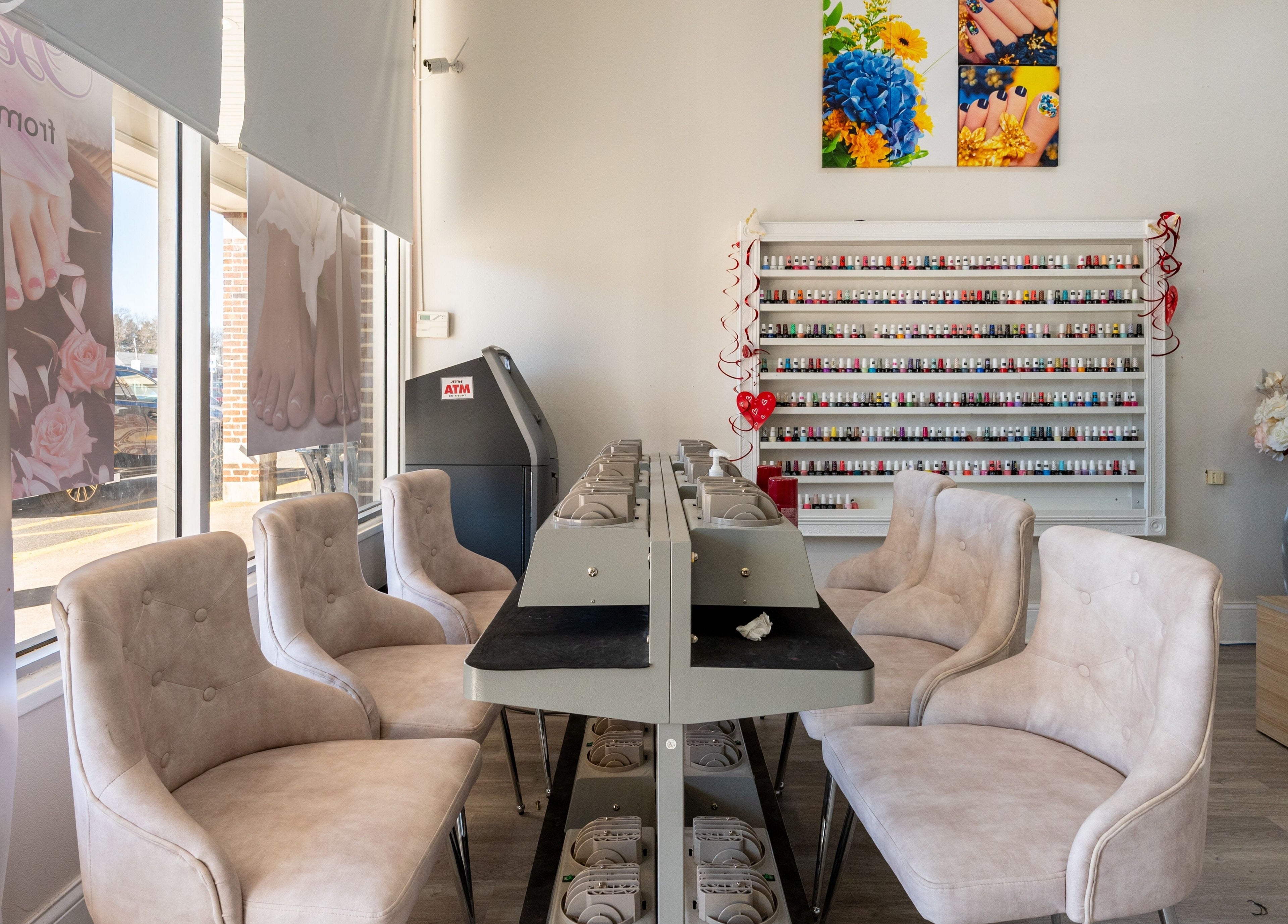 Luxor Nails and Spa interior with cushioned chairs and polish racks, North Reading, Massachusetts, US.