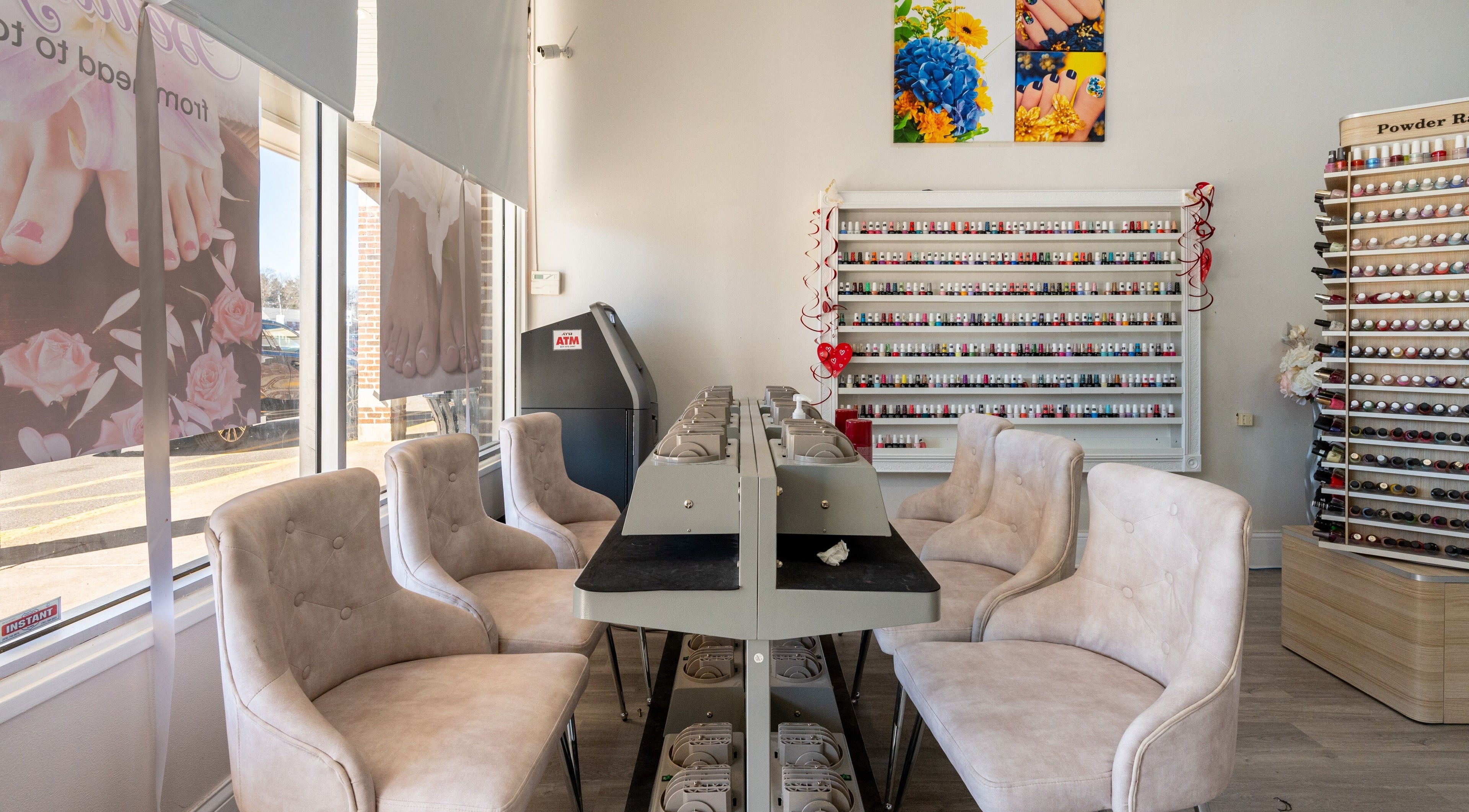 Luxor Nails and Spa interior with cushioned chairs and polish racks, North Reading, Massachusetts, US.