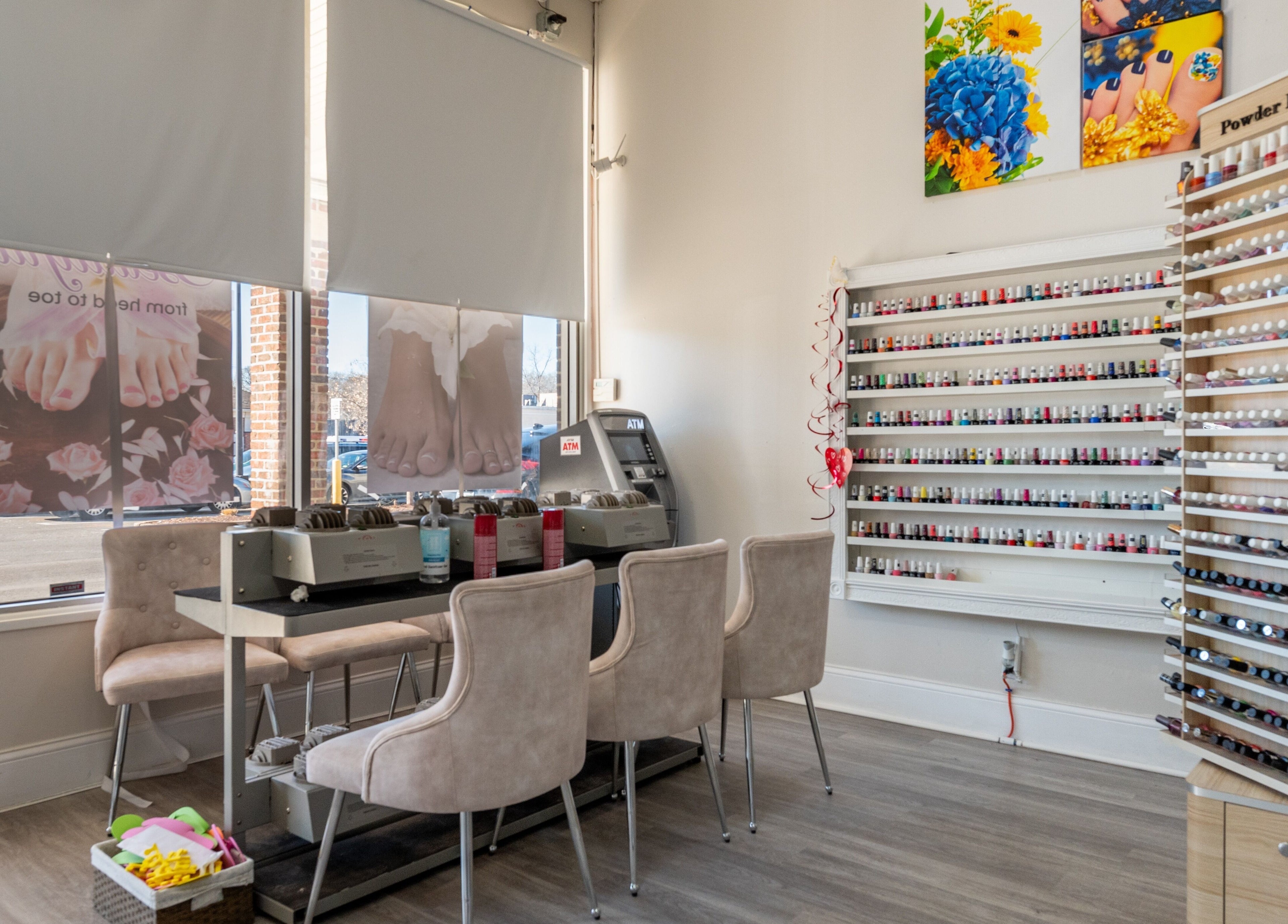 Luxor Nails and Spa interior in North Reading, Massachusetts, offering a wide range of polishes and cozy seating.