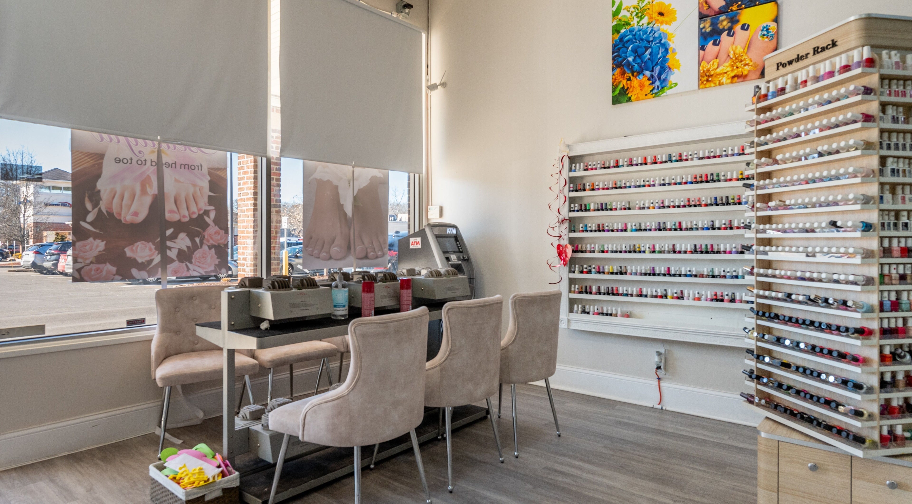 Luxor Nails and Spa interior in North Reading, Massachusetts, offering a wide range of polishes and cozy seating.