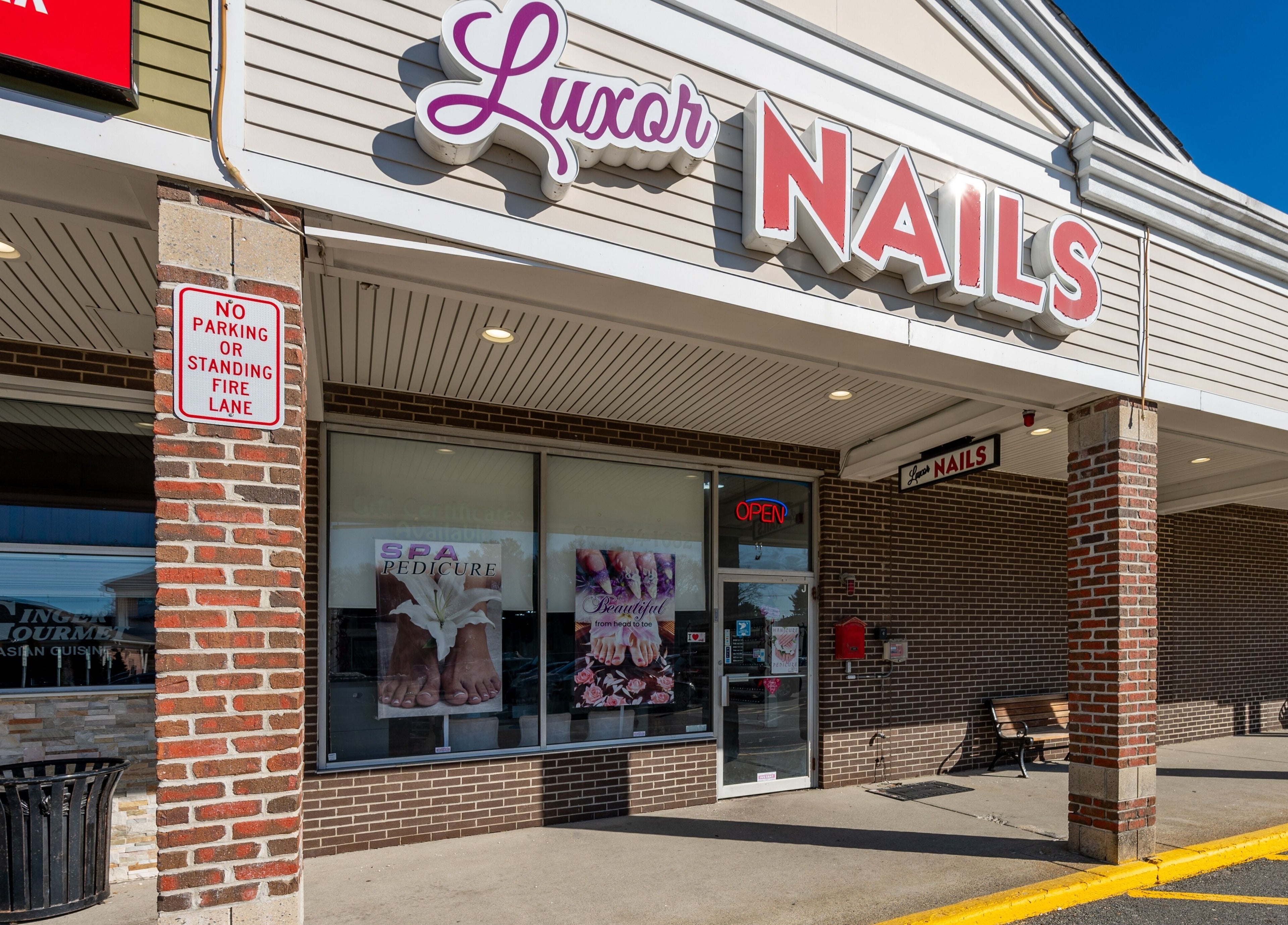 Entrance of Luxor Nails and Spa in North Reading, Massachusetts, US with stylish signage.