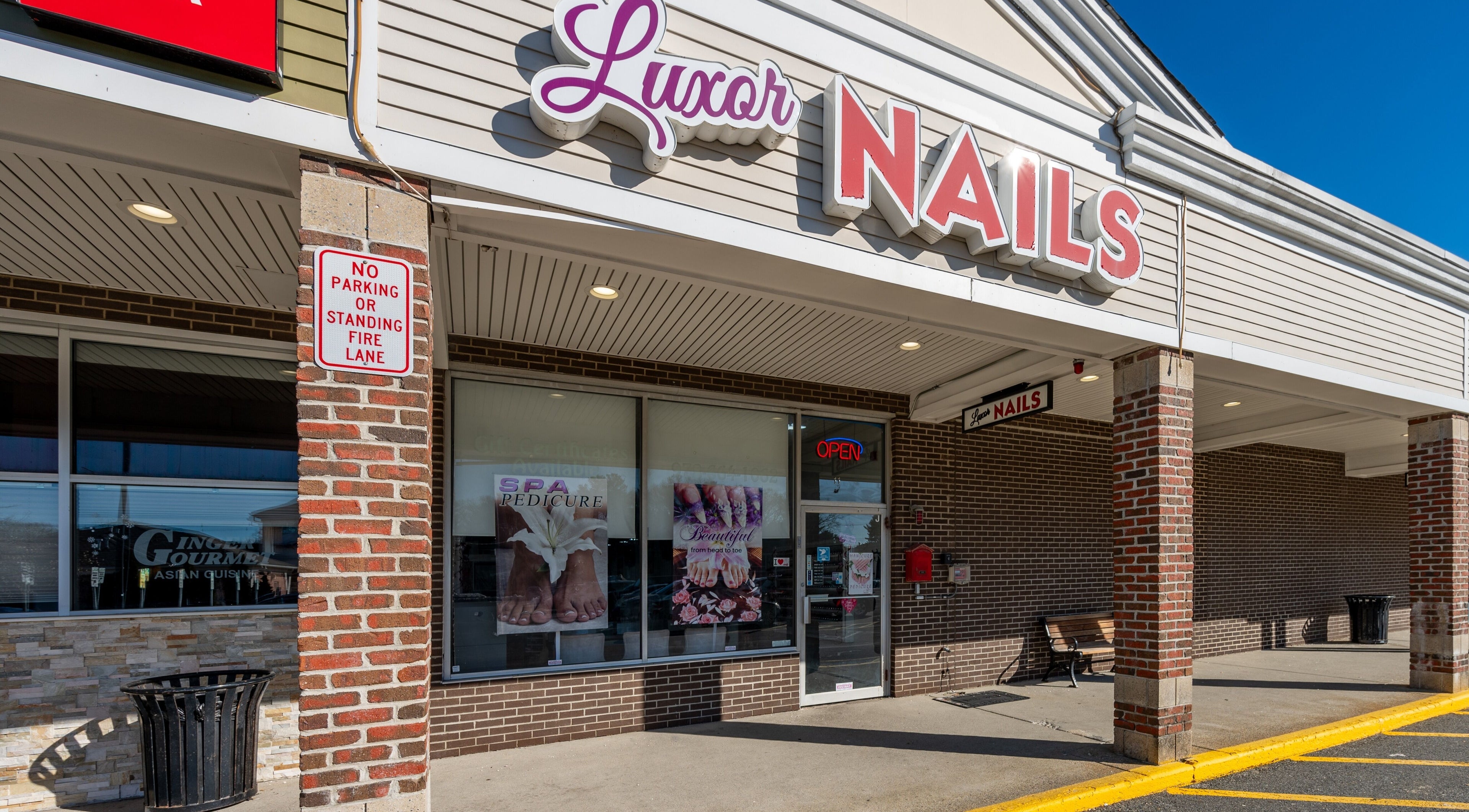 Entrance of Luxor Nails and Spa in North Reading, Massachusetts, US with stylish signage.