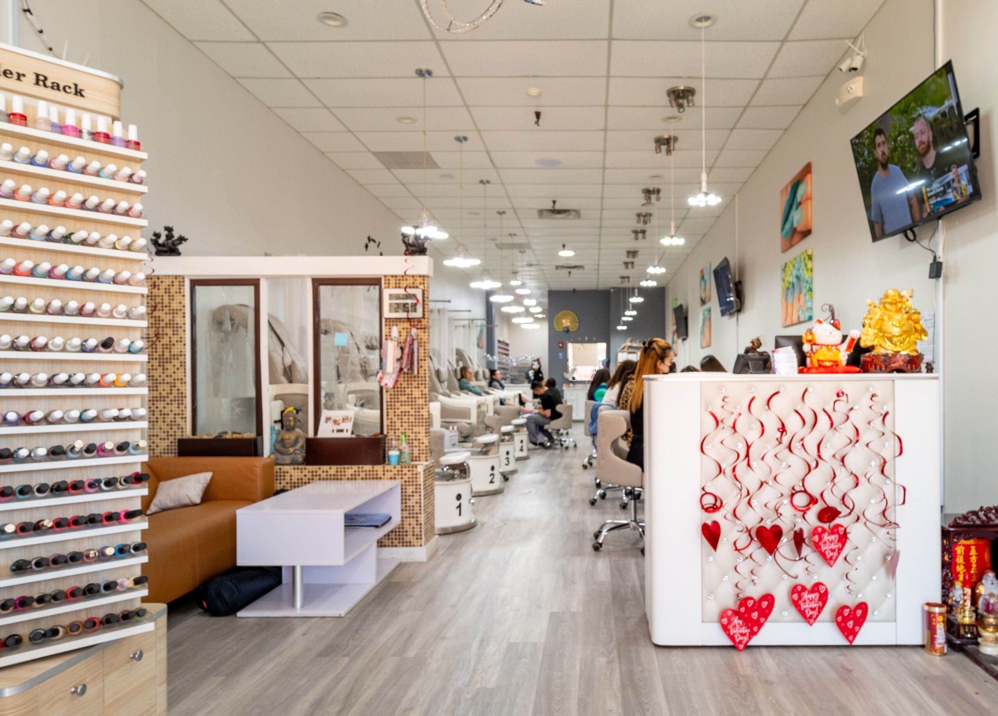 Luxor Nails and Spa interior in North Reading, Massachusetts, US, showcasing nail colors and serene ambiance.