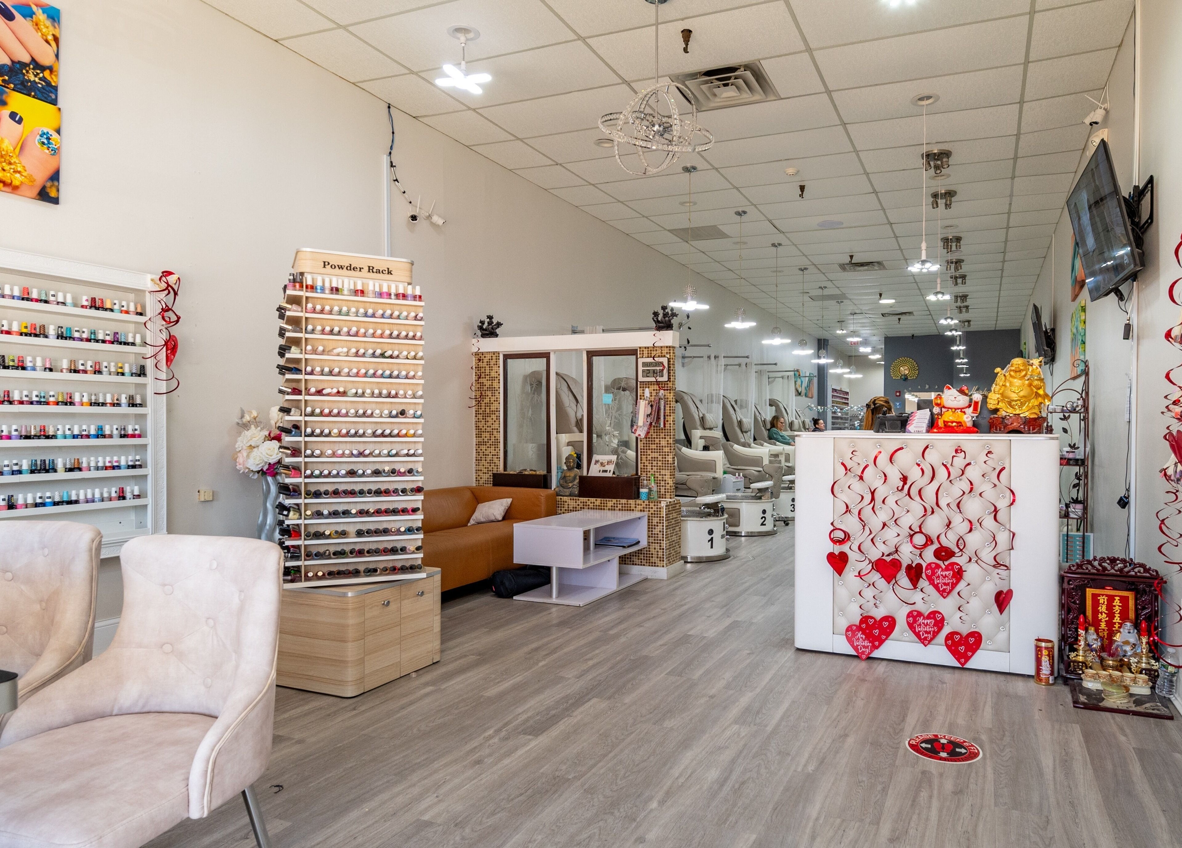 Luxor Nails and Spa in North Reading, Massachusetts, US offers a chic interior with nail polish displays and seating.