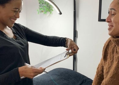 Smiling staff and client consultation at Beauty Collective in Cape Town, Western Cape, ZA.