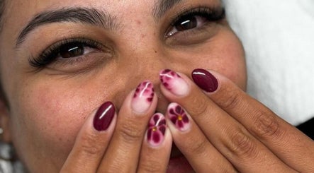 Floral nail art on fingers at Beauty Collective in Cape Town, Western Cape, ZA.