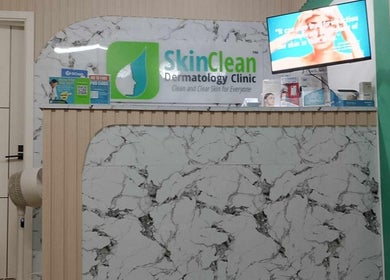 Reception area of Skin Clean Dermatology Clinic in Biñan, Calabarzon, PH with signage and display screen.