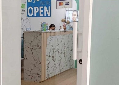 Marble reception desk at Skin Clean Dermatology Clinic, Biñan, Calabarzon, PH with welcoming staff.