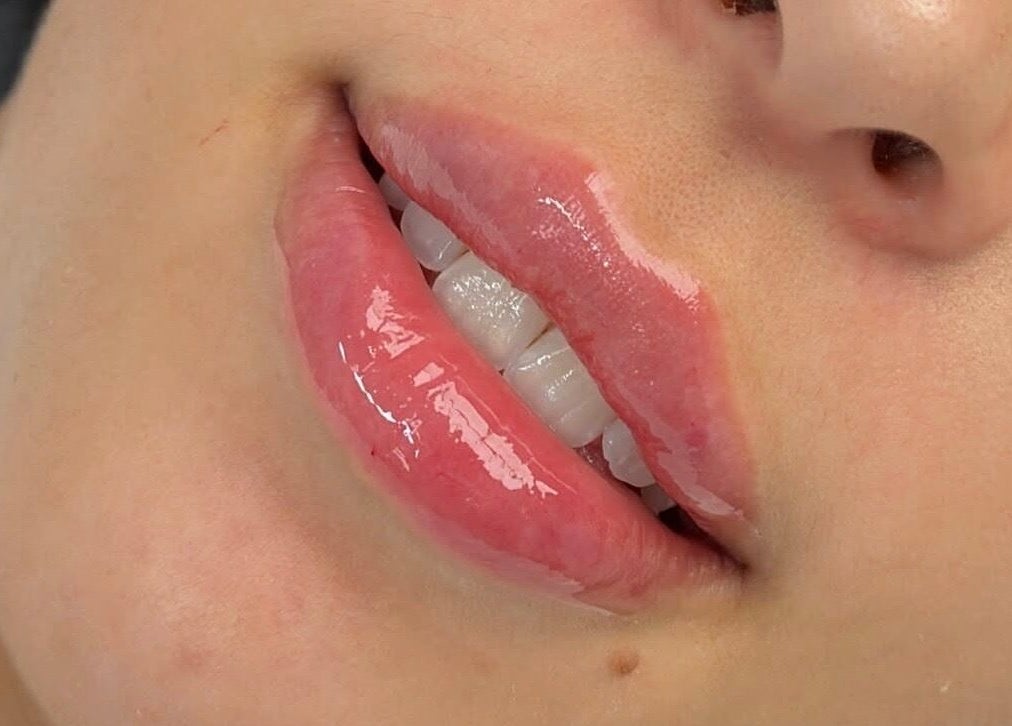 Close-up of glossy lips at Sophiesticated Beauty, Thatcham, England, GB showcasing lip treatments.