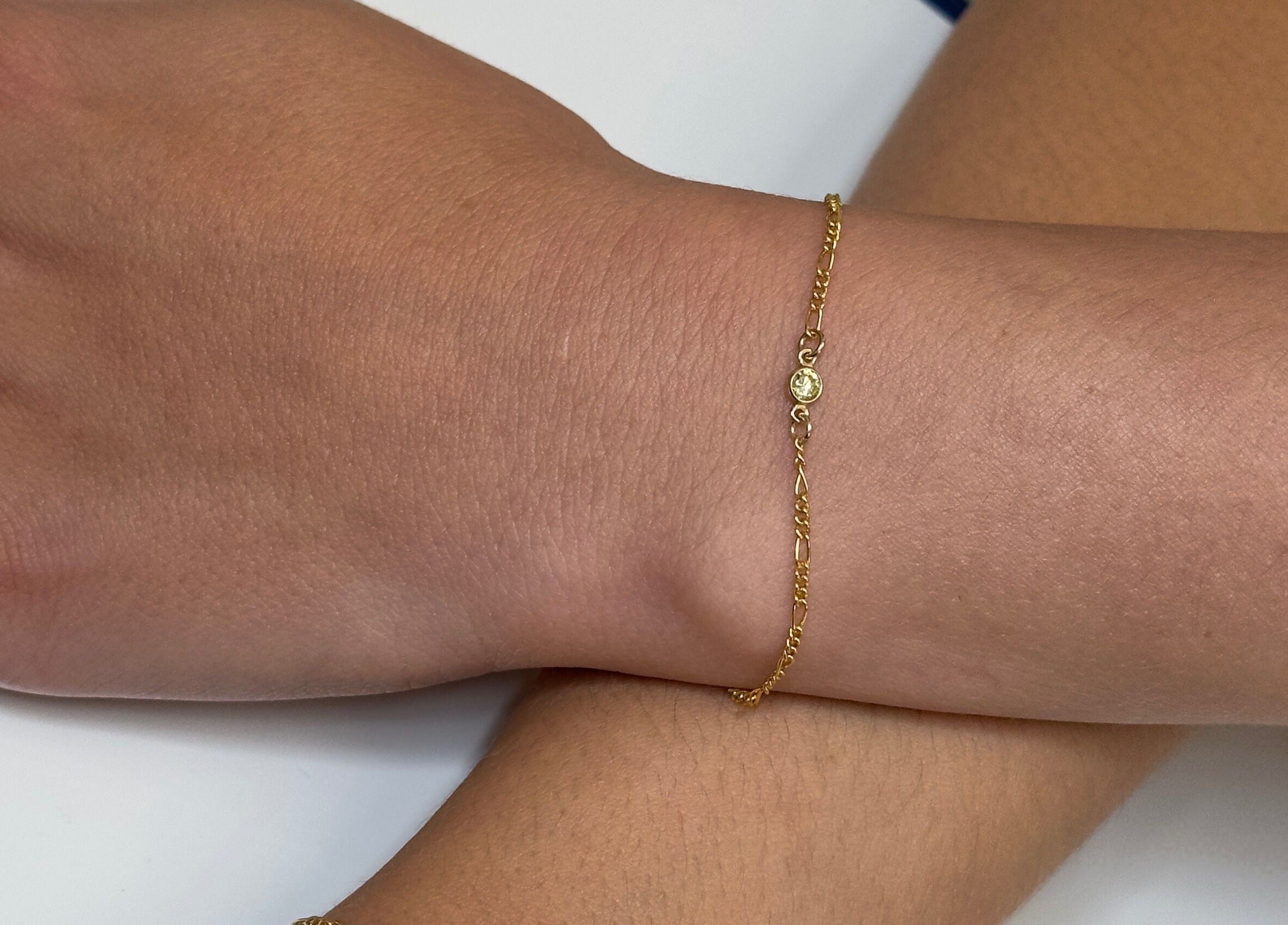 Gold bracelet on wrist at Sophiesticated Beauty, Thatcham, England, GB, showcasing delicate jewelry style.