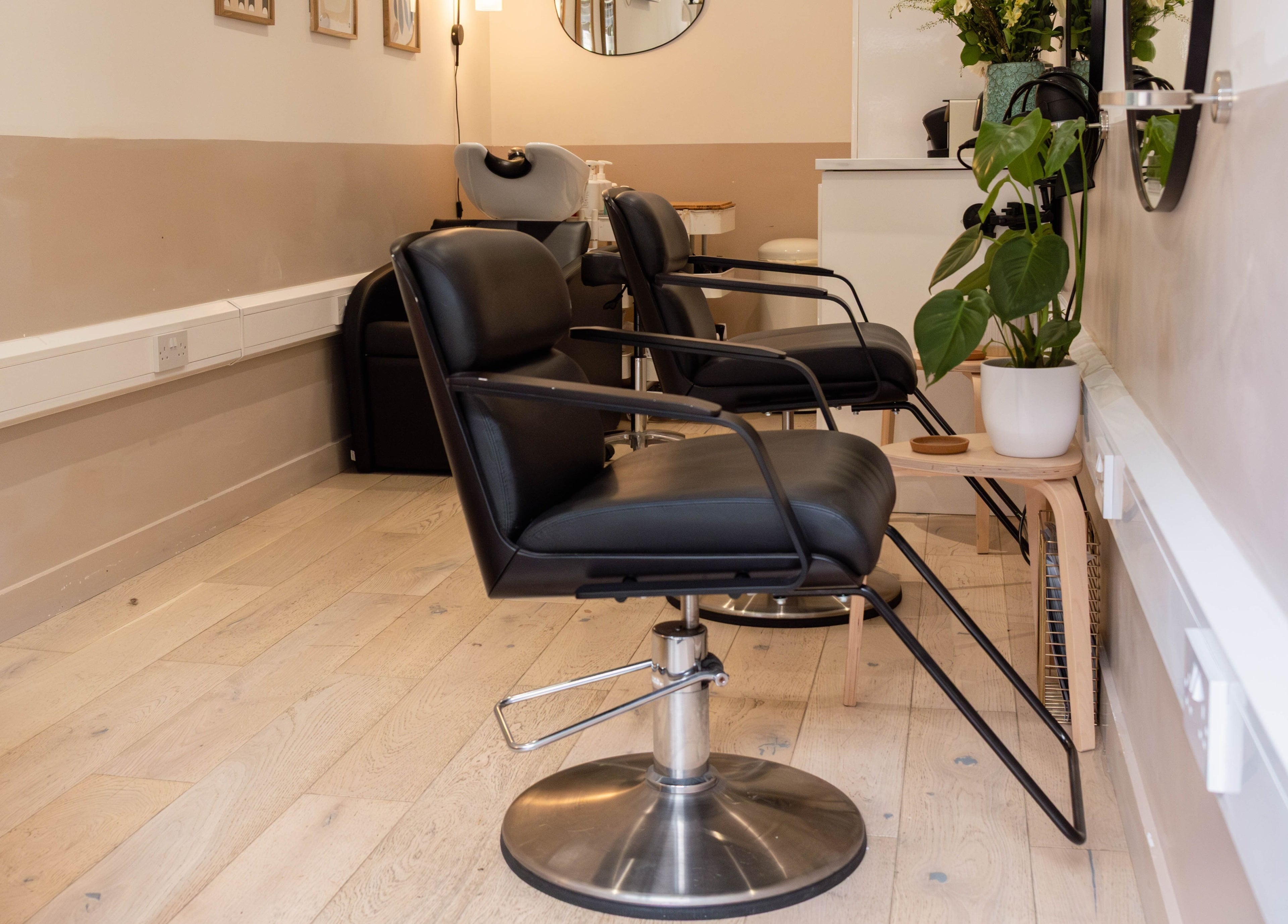Modern salon chairs at Home of Cole Jackson, London, England, GB. Stylish and relaxing ambiance for wellness.