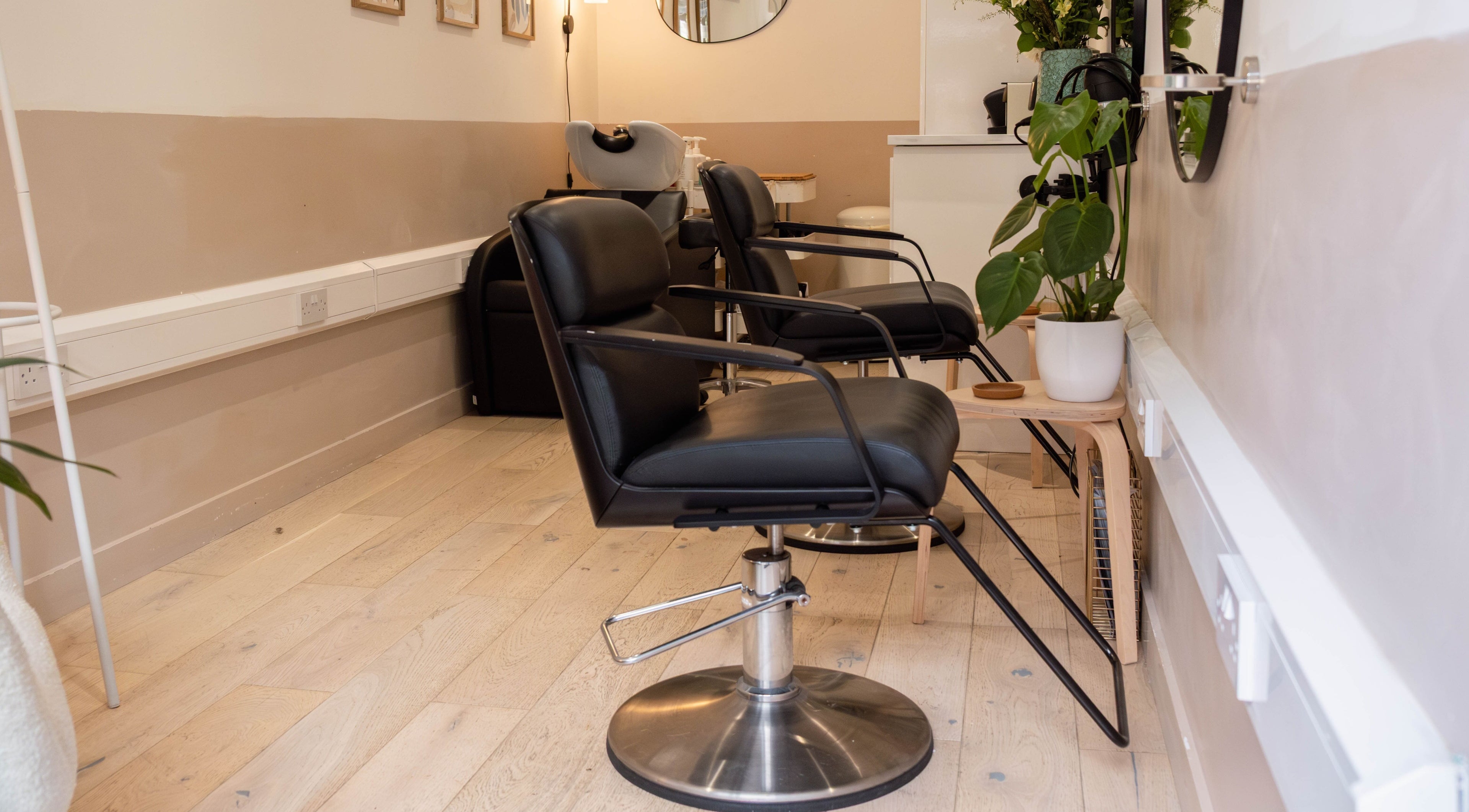 Modern salon chairs at Home of Cole Jackson, London, England, GB. Stylish and relaxing ambiance for wellness.