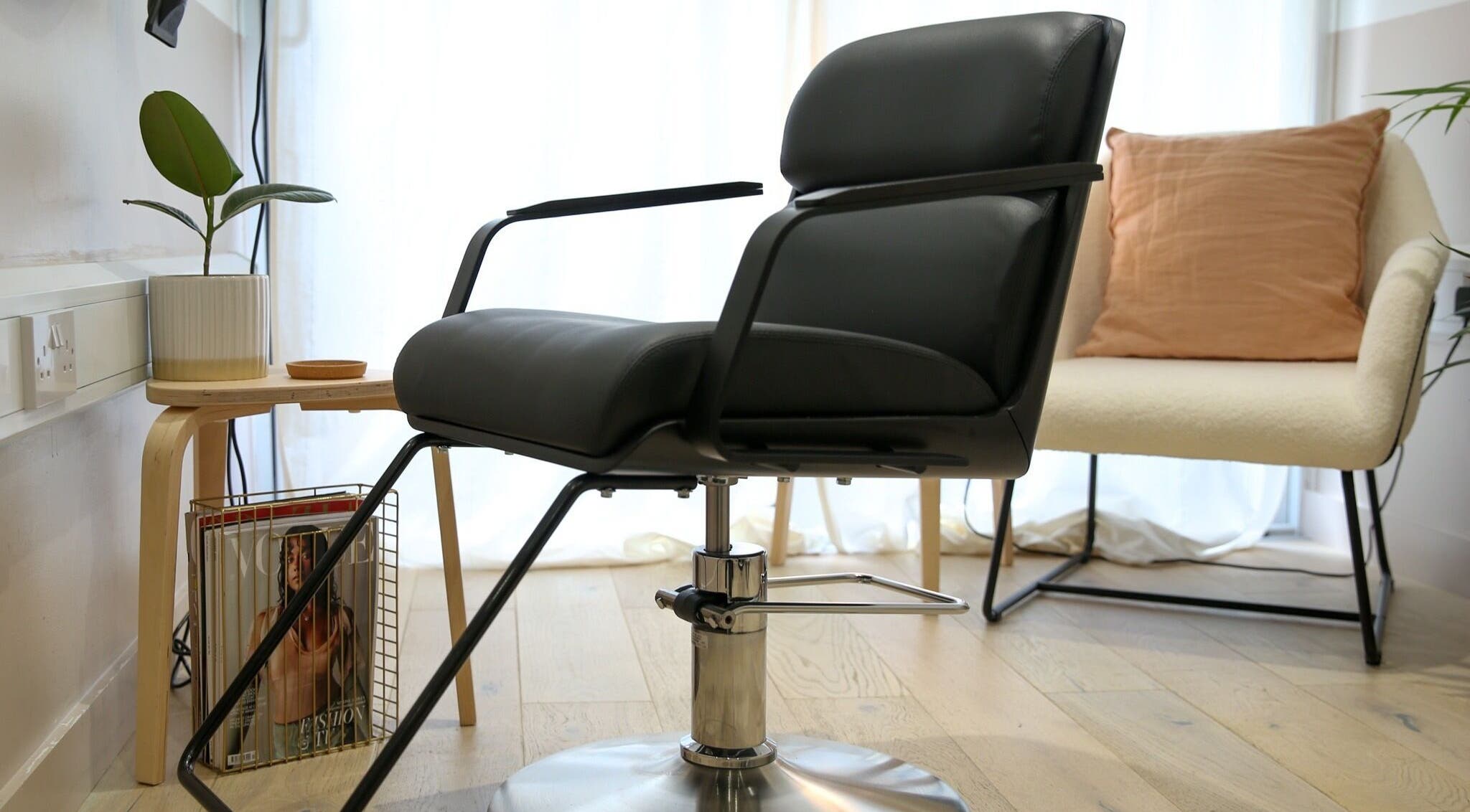 Stylish salon chair at Home of Cole Jackson, London, England, GB. Modern aesthetic for beauty services.