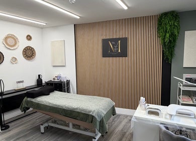 Beauty by Mandy salon interior in Whitehaven, England, featuring a sleek treatment area with modern decor.