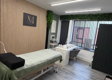 Cozy treatment room at Beauty by Mandy, Whitehaven, England, GB with spa bed and soothing decor.