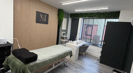 Cozy treatment room at Beauty by Mandy, Whitehaven, England, GB with spa bed and soothing decor.