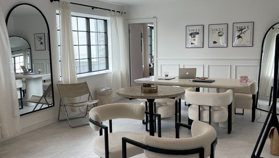 Modern lounge space at NAKD Beauty, Bridgend, Wales, GB with chic decor and elegant seating.