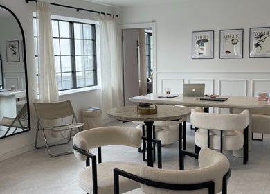 Modern lounge space at NAKD Beauty, Bridgend, Wales, GB with chic decor and elegant seating.