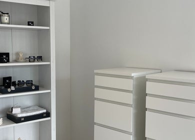 Sleek storage and display shelves at NAKD Beauty, Bridgend, Wales, GB, showcasing modern interior design.