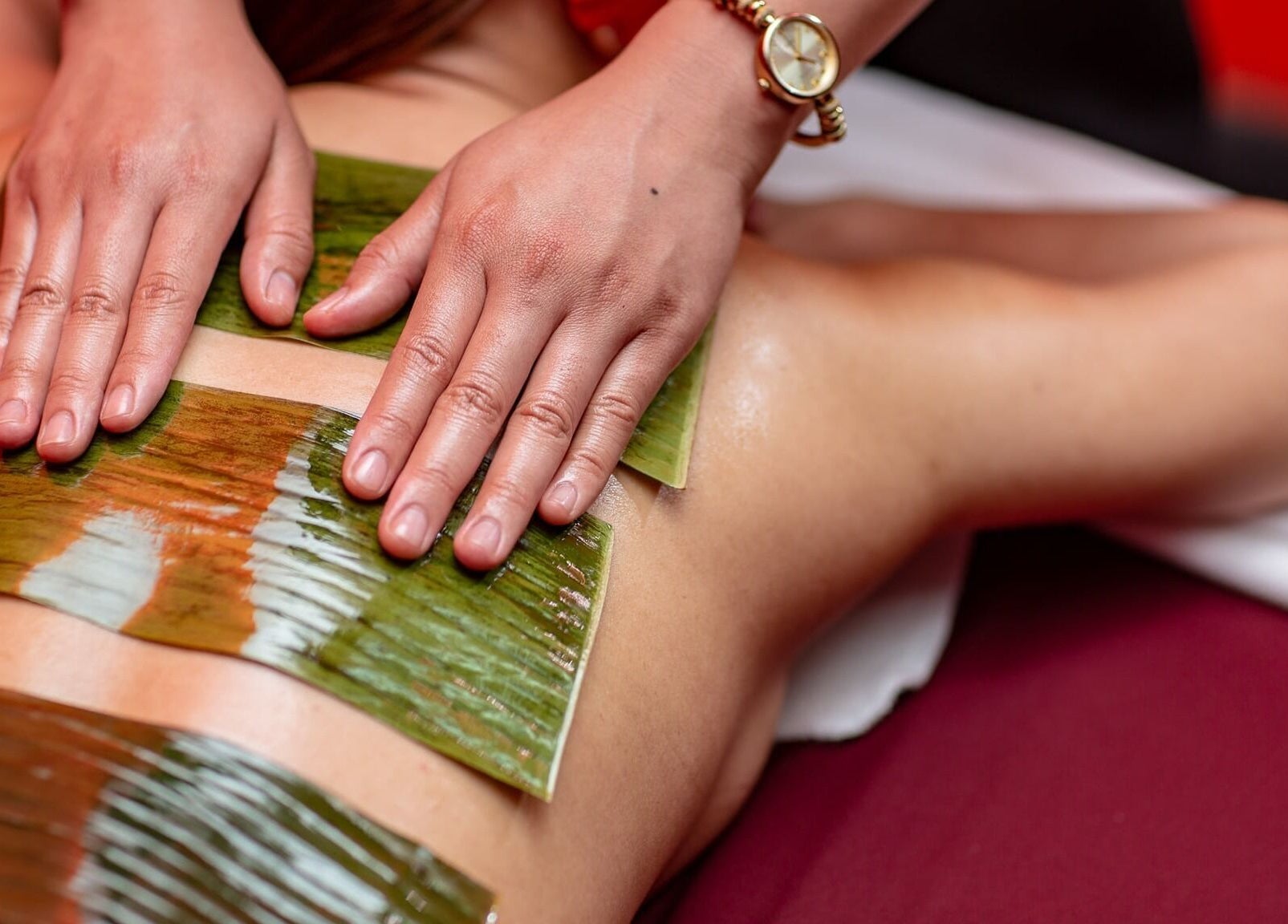 Herbal body treatment at Bamboo Spa Onehunga, Auckland, Auckland, NZ. Relaxing back therapy with natural leaves.