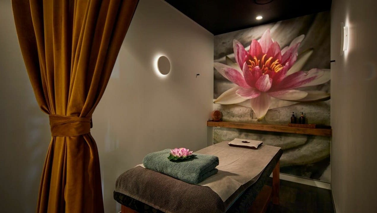Tranquil massage room at Sabai Thai Massage & Spa in Menai, New South Wales, AU, adorned with a lotus mural.
