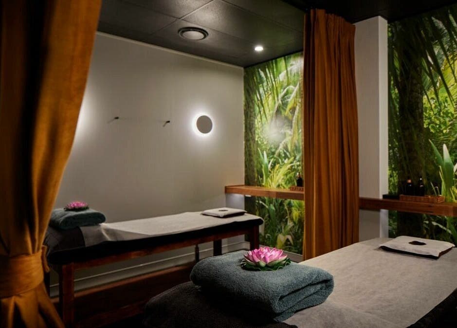Relaxing massage room at Sabai Thai Massage & Spa, Menai, New South Wales, AU. Features lush green decor.