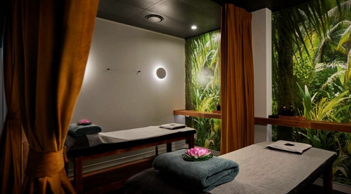 Relaxing massage room at Sabai Thai Massage & Spa, Menai, New South Wales, AU. Features lush green decor.