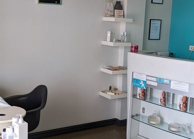 Reception area at V.I.B. Very Important Beauty, Balcatta, Western Australia, AU, showcasing product shelves and desk.