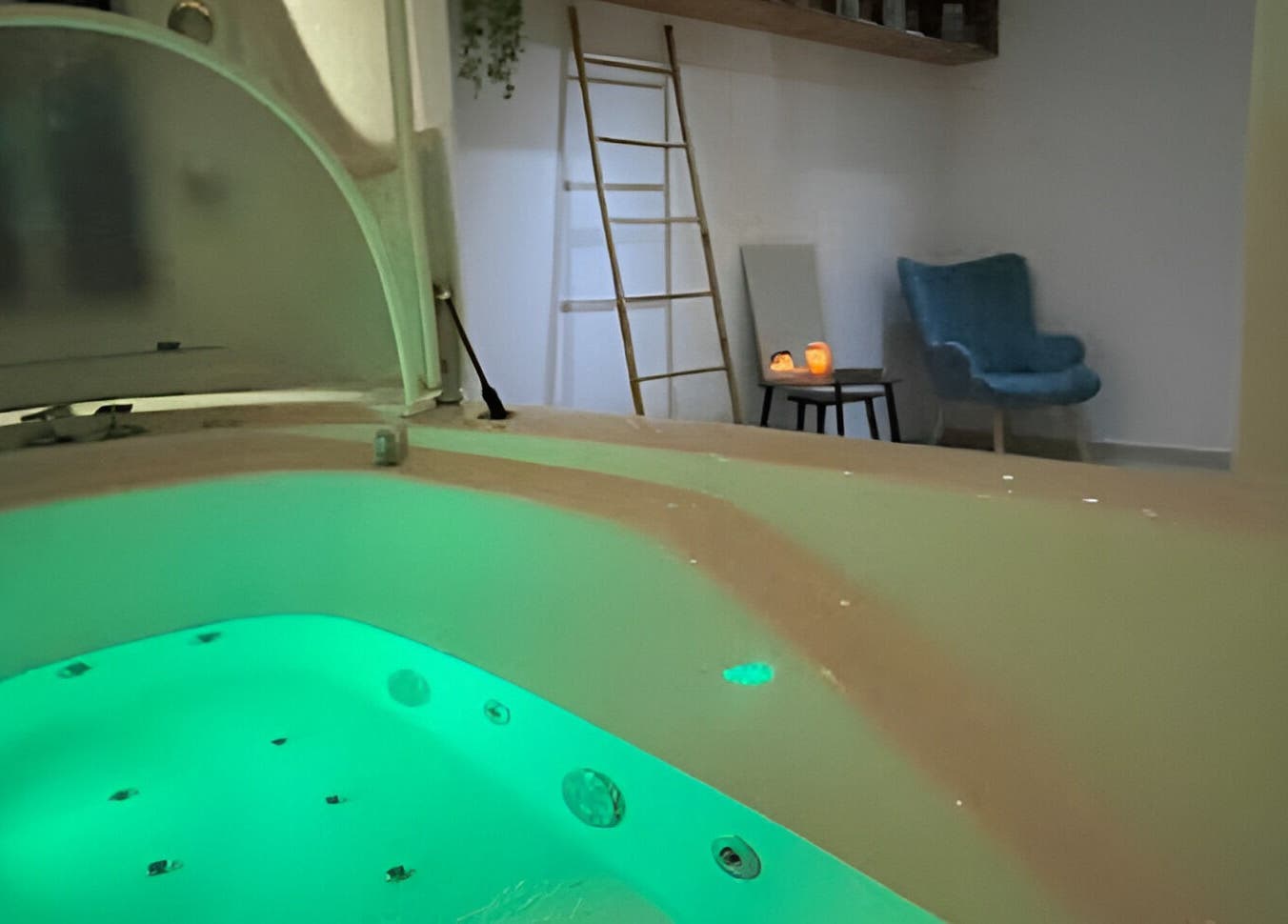 Relaxing spa bath with calming green light at Health First Clinic, Lemesos, Lemesos, CY. Elegant and tranquil setting.