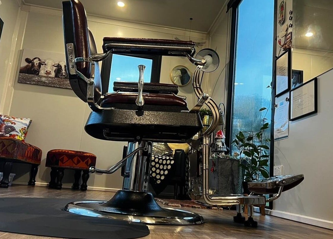 Stylish barber chair at Kaska Kuts Barber, Hamurana, Bay of Plenty, NZ, offering a cozy grooming space.