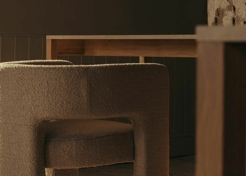 Elegant seating at Buff St Ninian's Manse, Edinburgh, Scotland, GB is highlighted by natural light and warm textures.