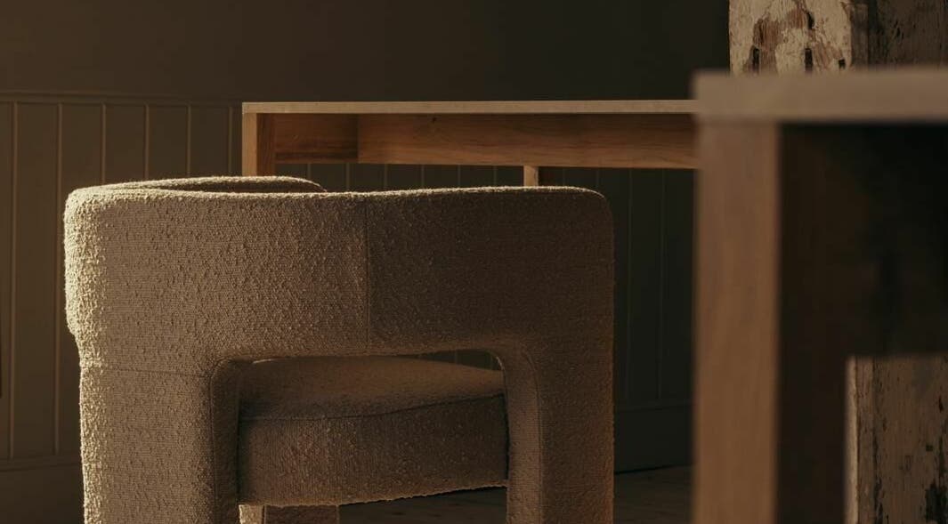 Elegant seating at Buff St Ninian's Manse, Edinburgh, Scotland, GB is highlighted by natural light and warm textures.