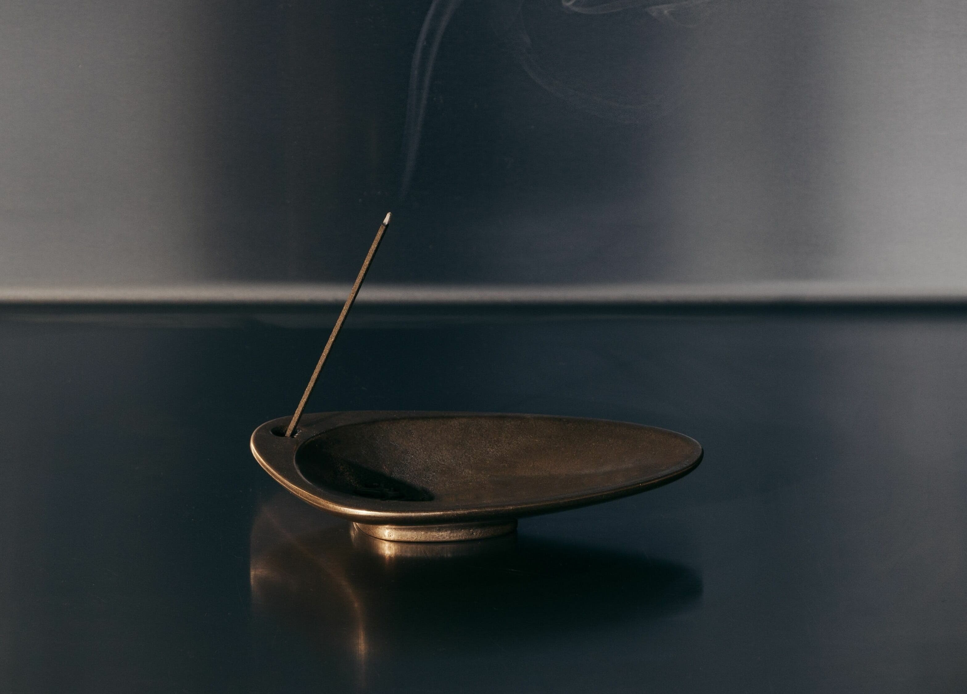 Incense burning in minimal holder at Buff Concept Store, Edinburgh, Scotland, GB. Perfect for wellness ambiance.