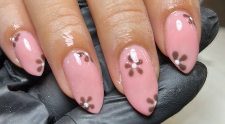 Beautiful floral nail art by Nails By Donna in Cannock, England, GB, featuring pink polish with delicate flower designs.