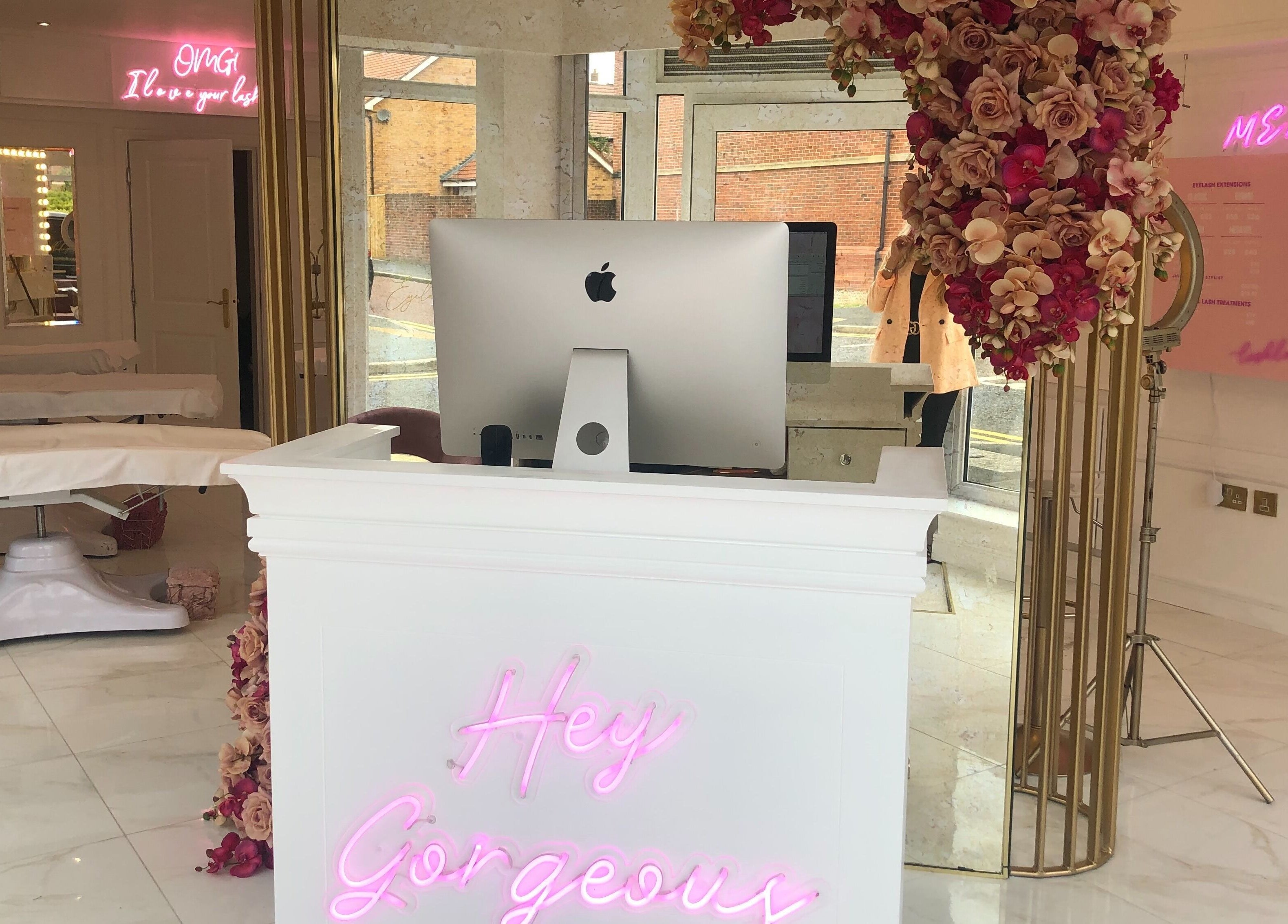 Stylish reception at The Lashloft, Newcastle upon Tyne, England with floral decor and modern design.