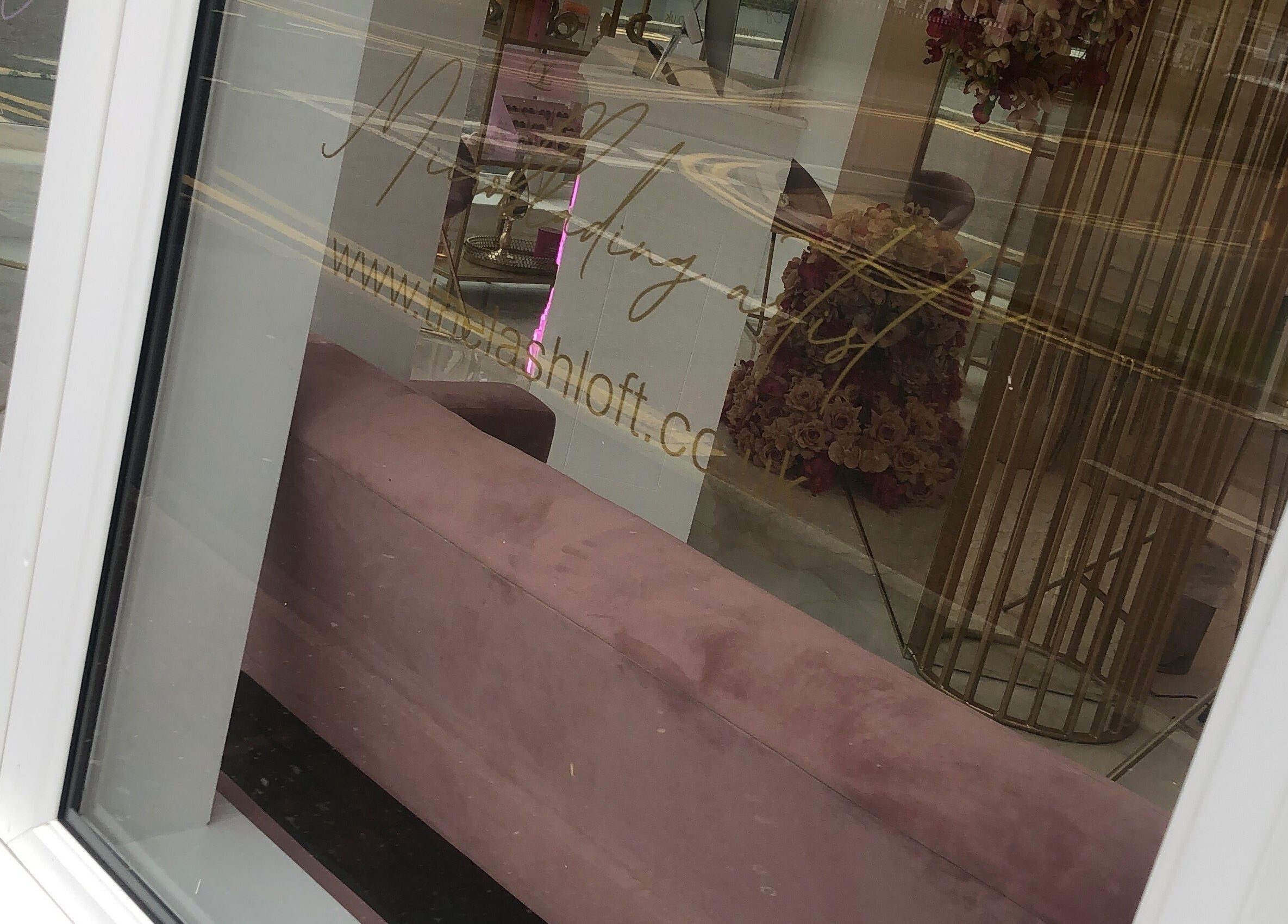 View through the window of The Lashloft in Newcastle upon Tyne, England, GB, showcasing a chic interior decor.