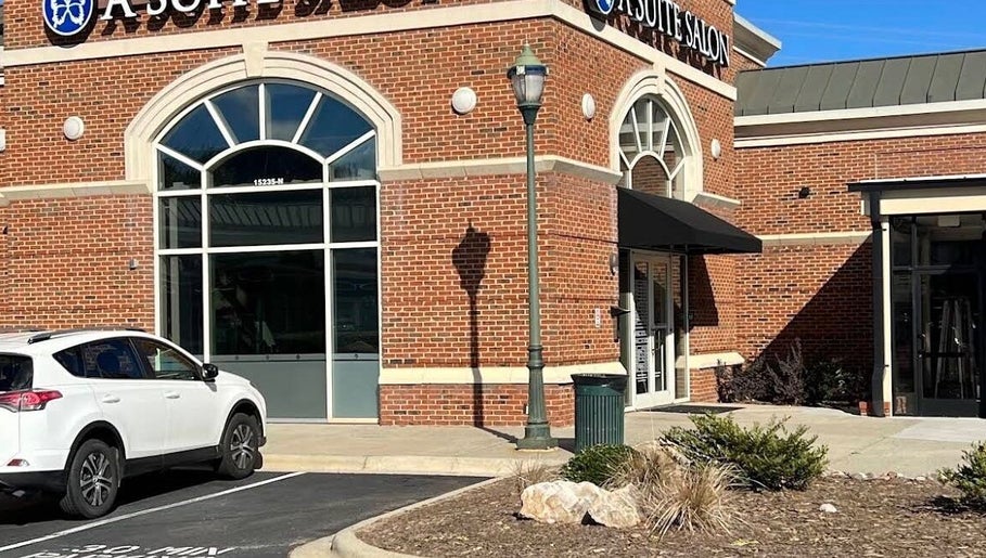 Exterior view of Colored by Megan in Charlotte, North Carolina, US, featuring a stylish red-brick design.