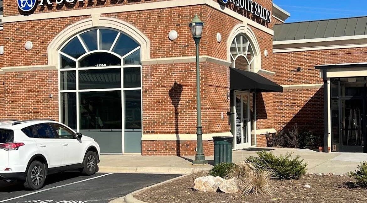 Exterior view of Colored by Megan in Charlotte, North Carolina, US, featuring a stylish red-brick design.