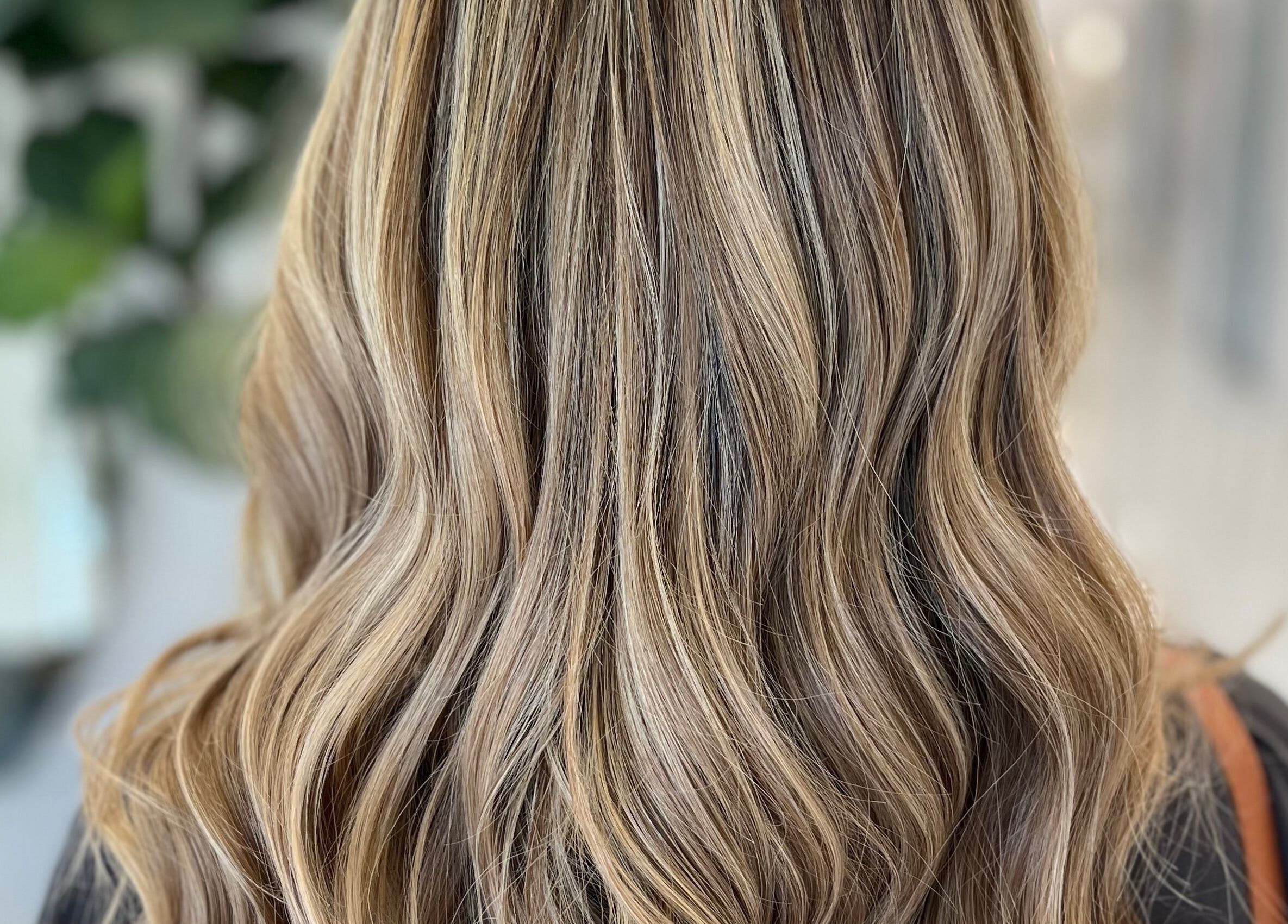 Beautiful wavy blonde hair at Colored by Megan, Charlotte, North Carolina, US.