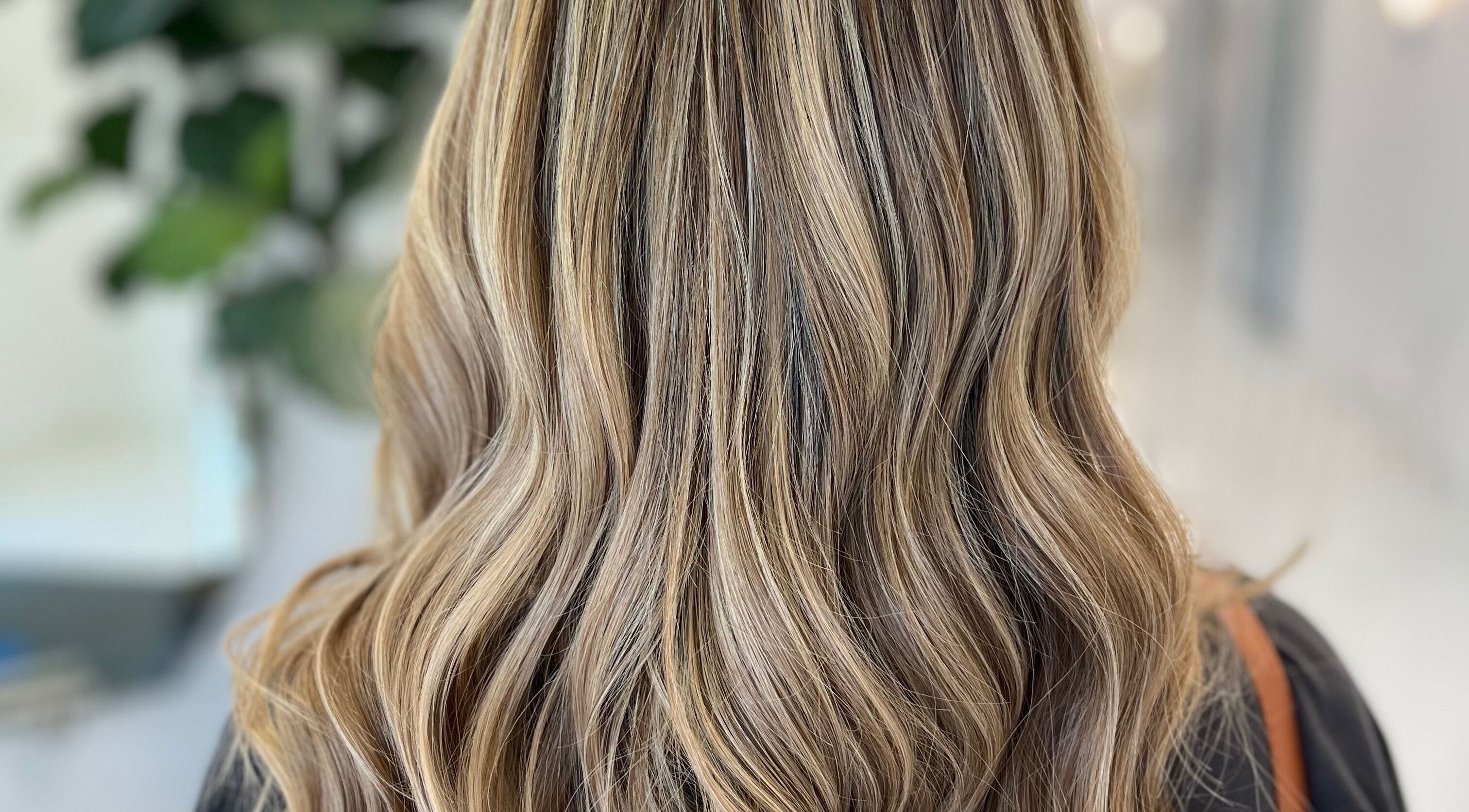 Beautiful wavy blonde hair at Colored by Megan, Charlotte, North Carolina, US.