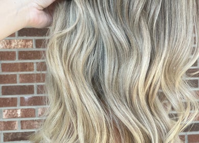 Blonde highlights styled in waves at Colored by Megan in Charlotte, North Carolina, US.