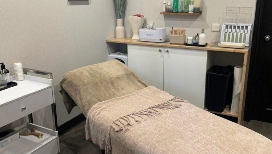 Cozy treatment room at Butterfly Beauty, Elgin, Scotland, GB featuring a massage table with warm tones.