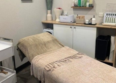 Cozy treatment room at Butterfly Beauty, Elgin, Scotland, GB featuring a massage table with warm tones.